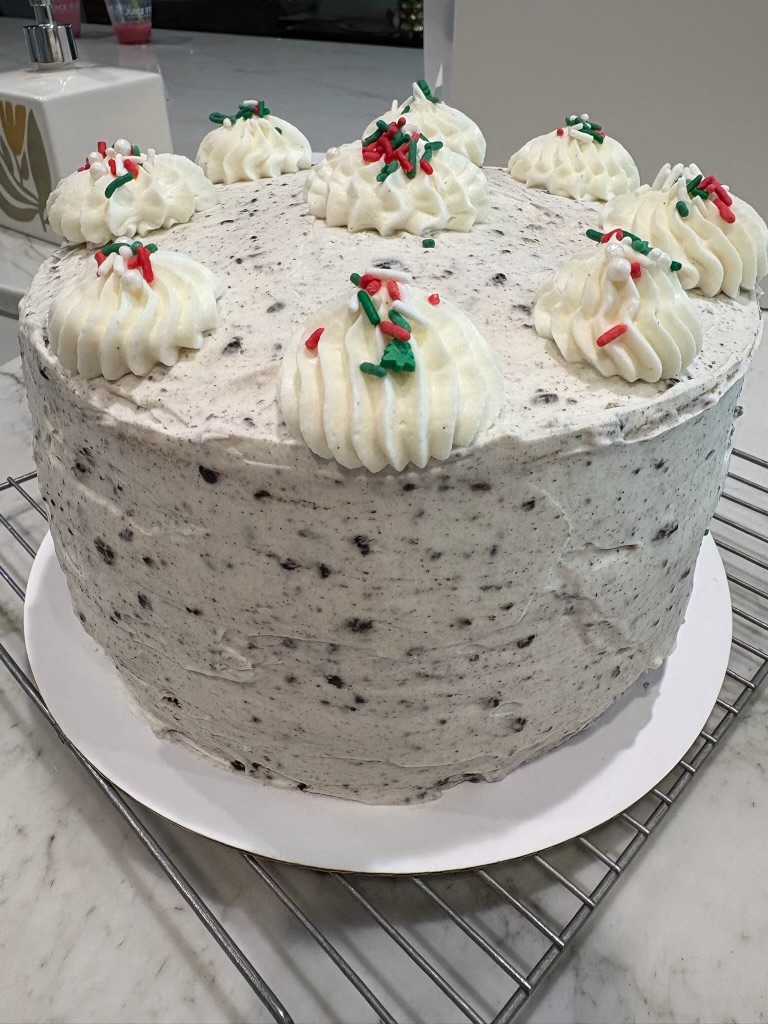 Layered chocolate cake decorated with Oreo cookies